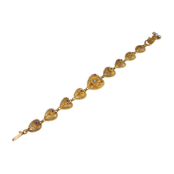 Gold and gem set heart bracelet, with nine bombe hearts on a hand clasp